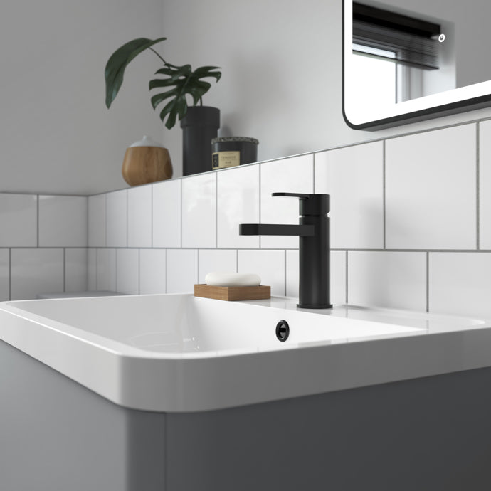 Bathroom sink with black faucet 