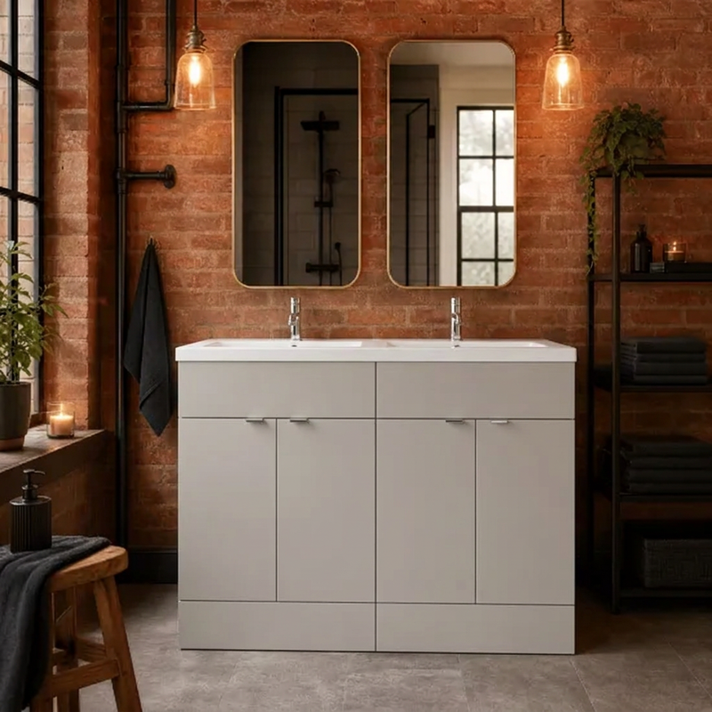 Pebble Grey double basin vanity in an exposed-brick bathroom with twin mirrors and warm pendant lighting