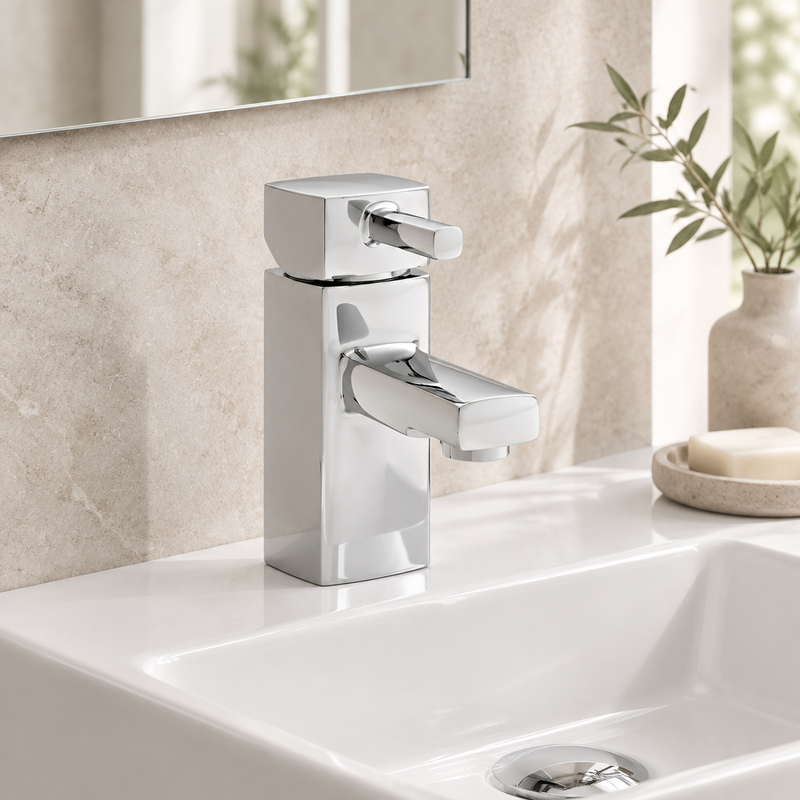 Kartell Mode Mini polished chrome single-lever basin mixer mounted on a compact white ceramic basin