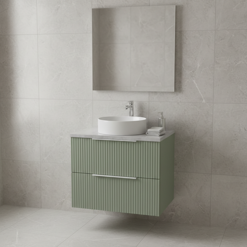 Hudson Reed sage green ribbed wall-hung 2 drawer vanity unit with flat marble-effect worktop and white vessel basin sitting on top, styled in a bright designer bathroom