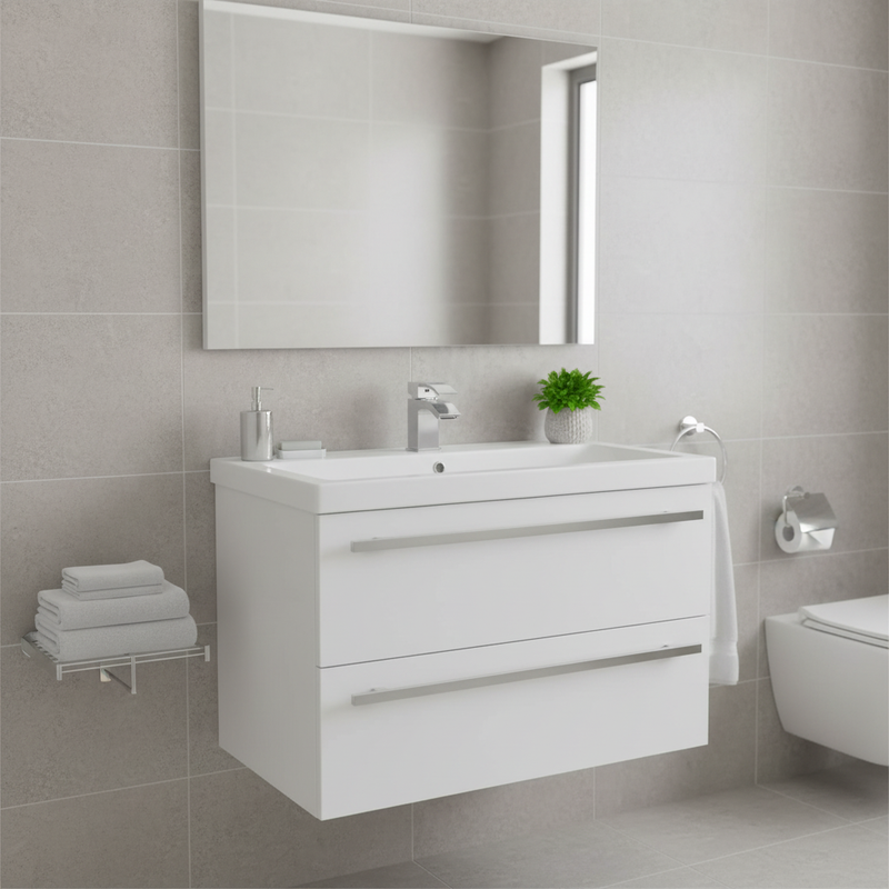 White gloss flat-front wall-mounted vanity unit with two drawers, chrome bar handles, integrated ceramic basin and chrome mono tap in a bright modern bathroom setting