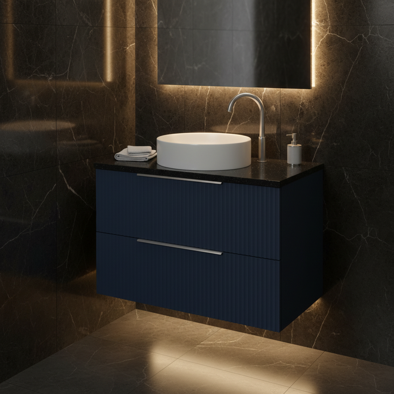 Hudson Reed navy blue ribbed wall-hung 2 drawer vanity unit with black marble worktop and single white vessel basin with tall chrome tap styled in a sophisticated dark designer bathroom